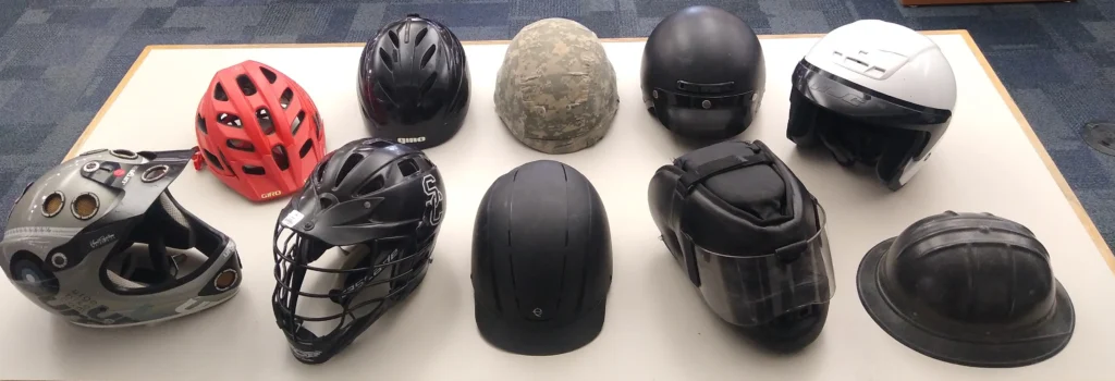 How far should a beginner cyclist ride - An image of different types of bicycle helmets