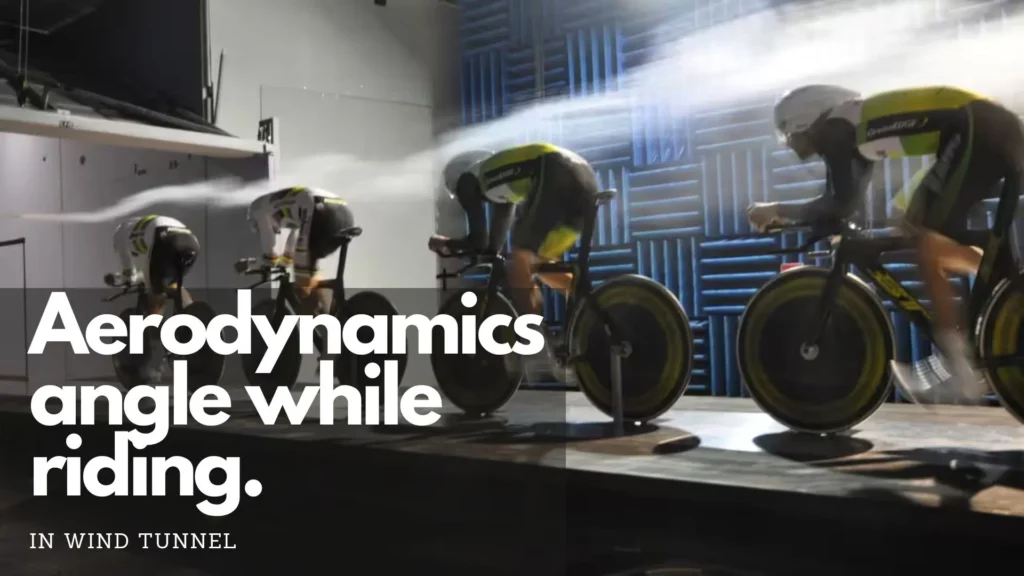 Cyclists riding at artificial trainer for testing aerodynamics.