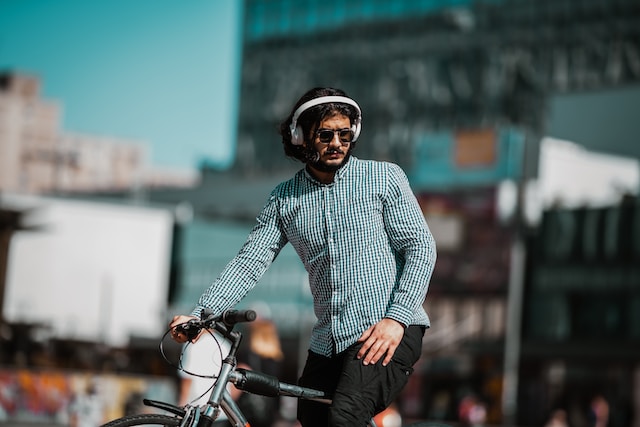 a man wearing headphones while cycling
