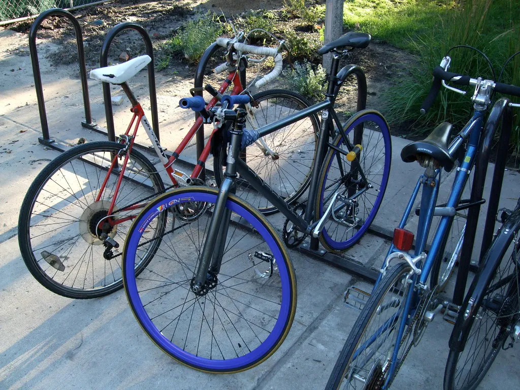 4 bicycle parked at a parking lot.