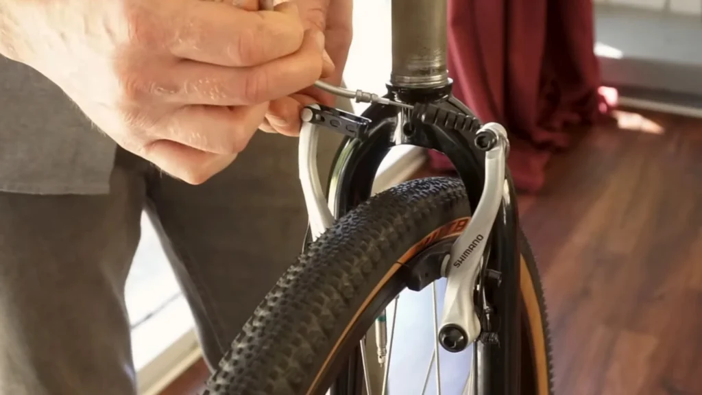installing caliper brakes on a bike and adjusting the brake wire